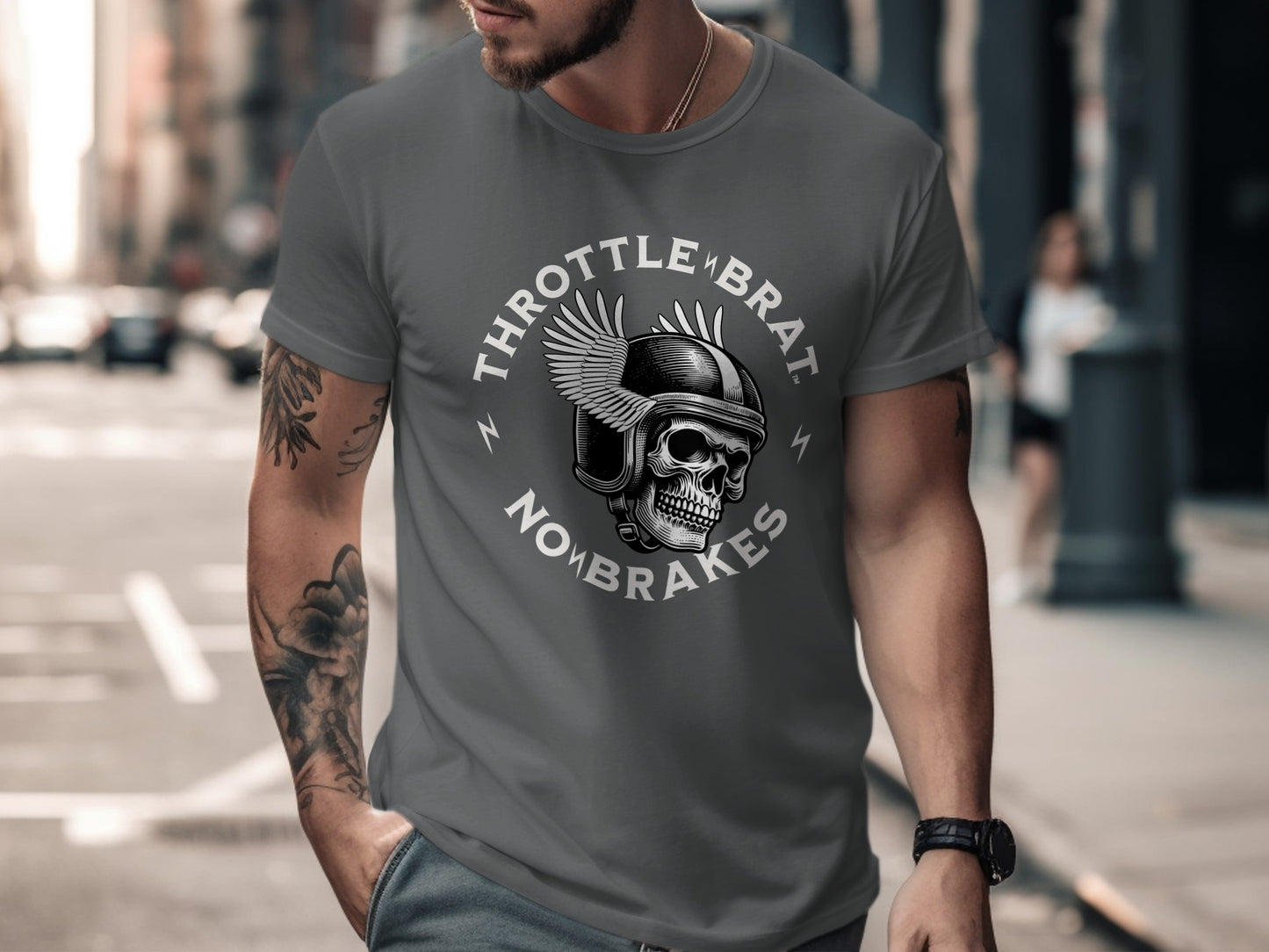 Skull with wings and text "Throttle Brat No Brakes" on a gray t-shirt.