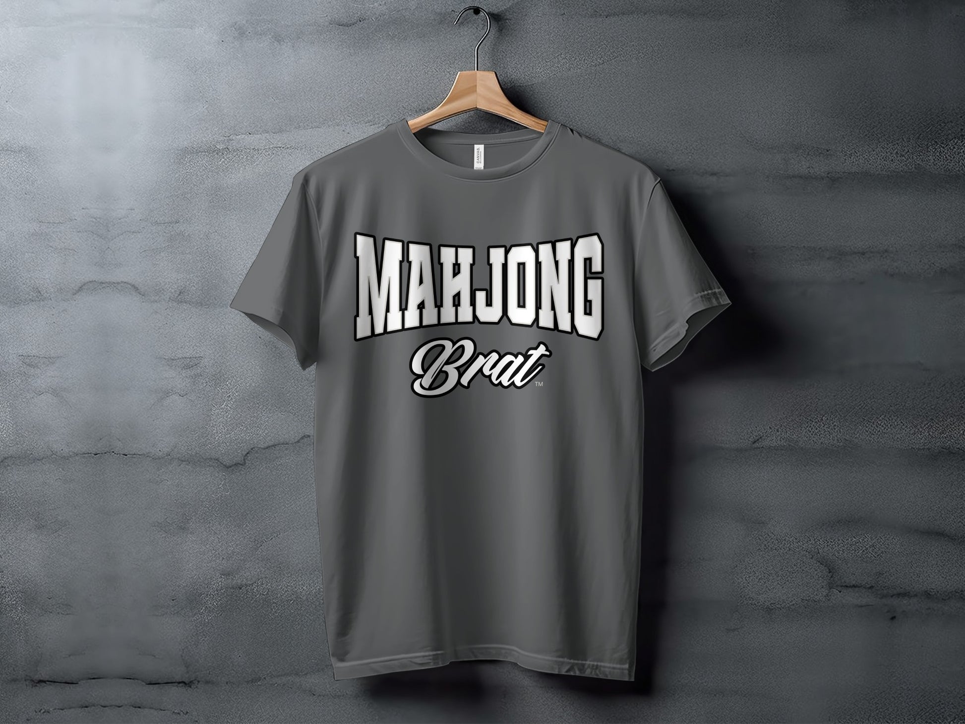 Grey t-shirt with white text "MAHJONG Brat" printed on the front.