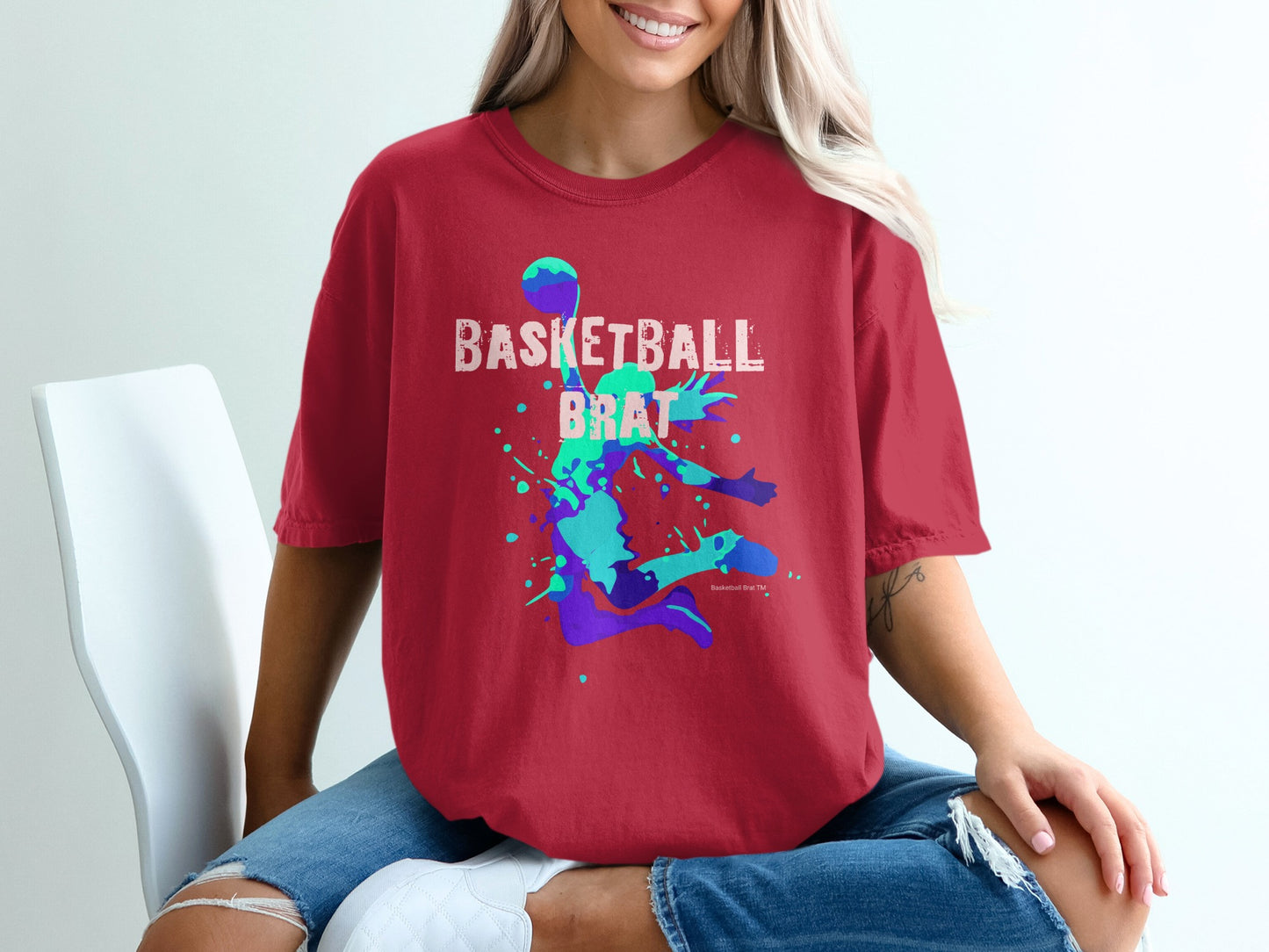 Red t-shirt with "Basketball Brat" text and a stylized basketball player graphic.