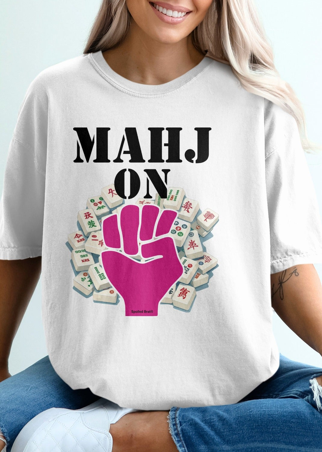 Mahjong hand design on a white t-shirt with pink fist.