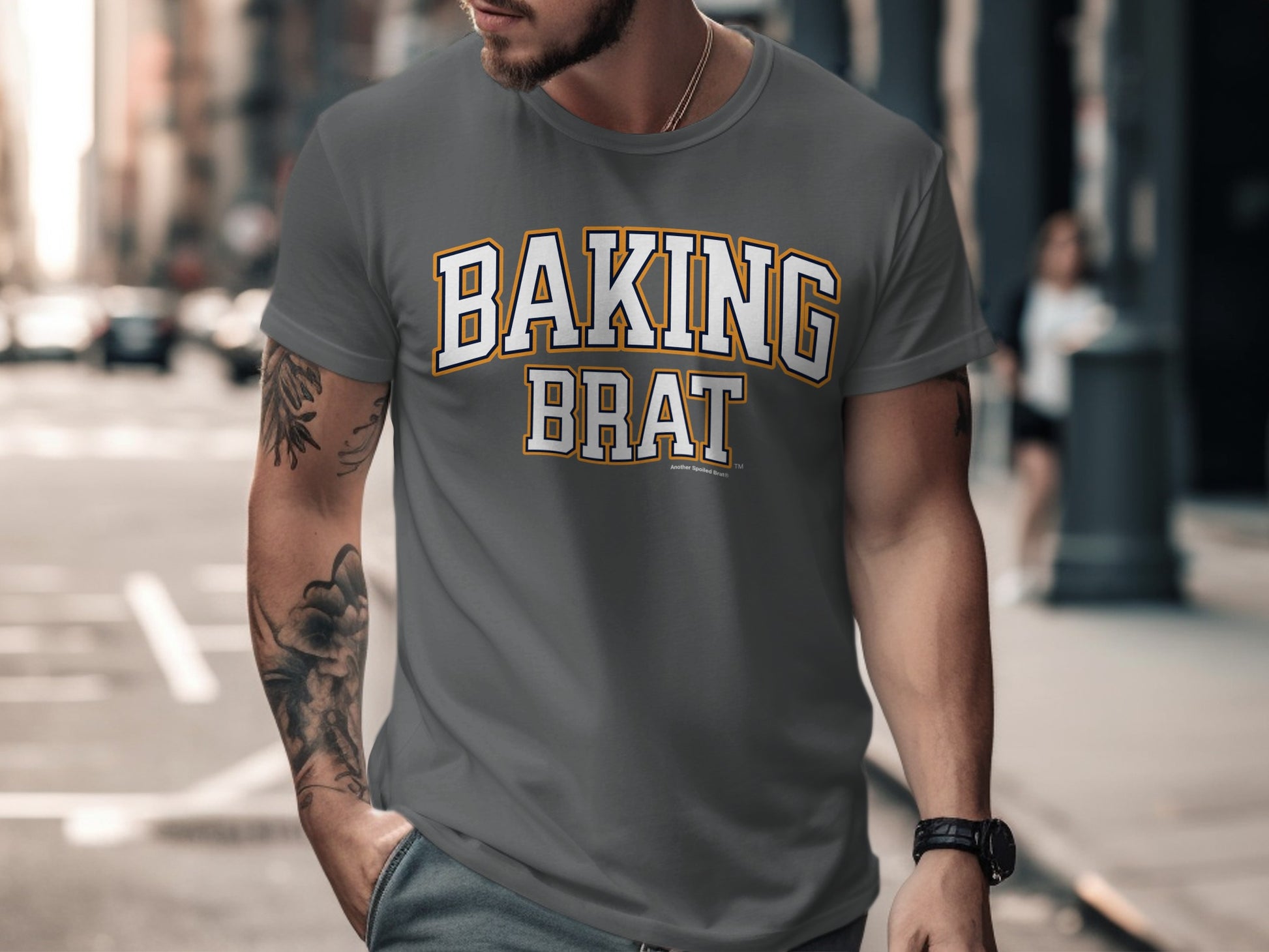 Gray t-shirt with "BAKING BRAT" in varsity-style font.