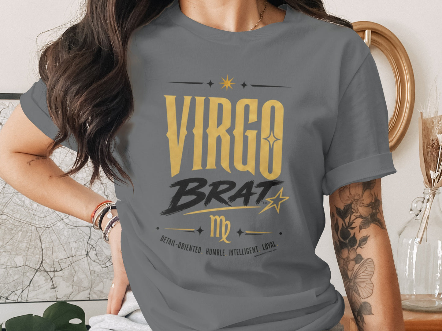 Virgo Brat graphic on a gray t-shirt with zodiac traits: detail-oriented, humble, intelligent, loyal.