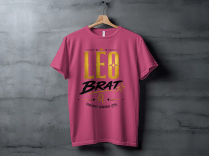Pink t-shirt with gold "LEO BRAT" text, Leo symbol, and descriptive words.