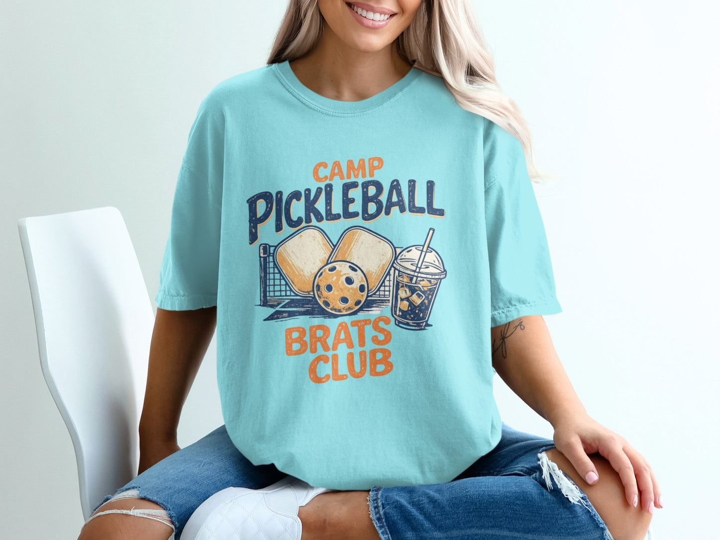 Light blue t-shirt with pickleball graphic: "Camp Pickleball Brats Club".