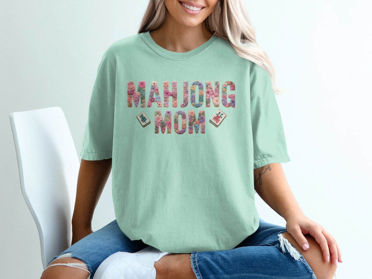 Mint t-shirt with "Mahjong Mom" text and mahjong tiles.
