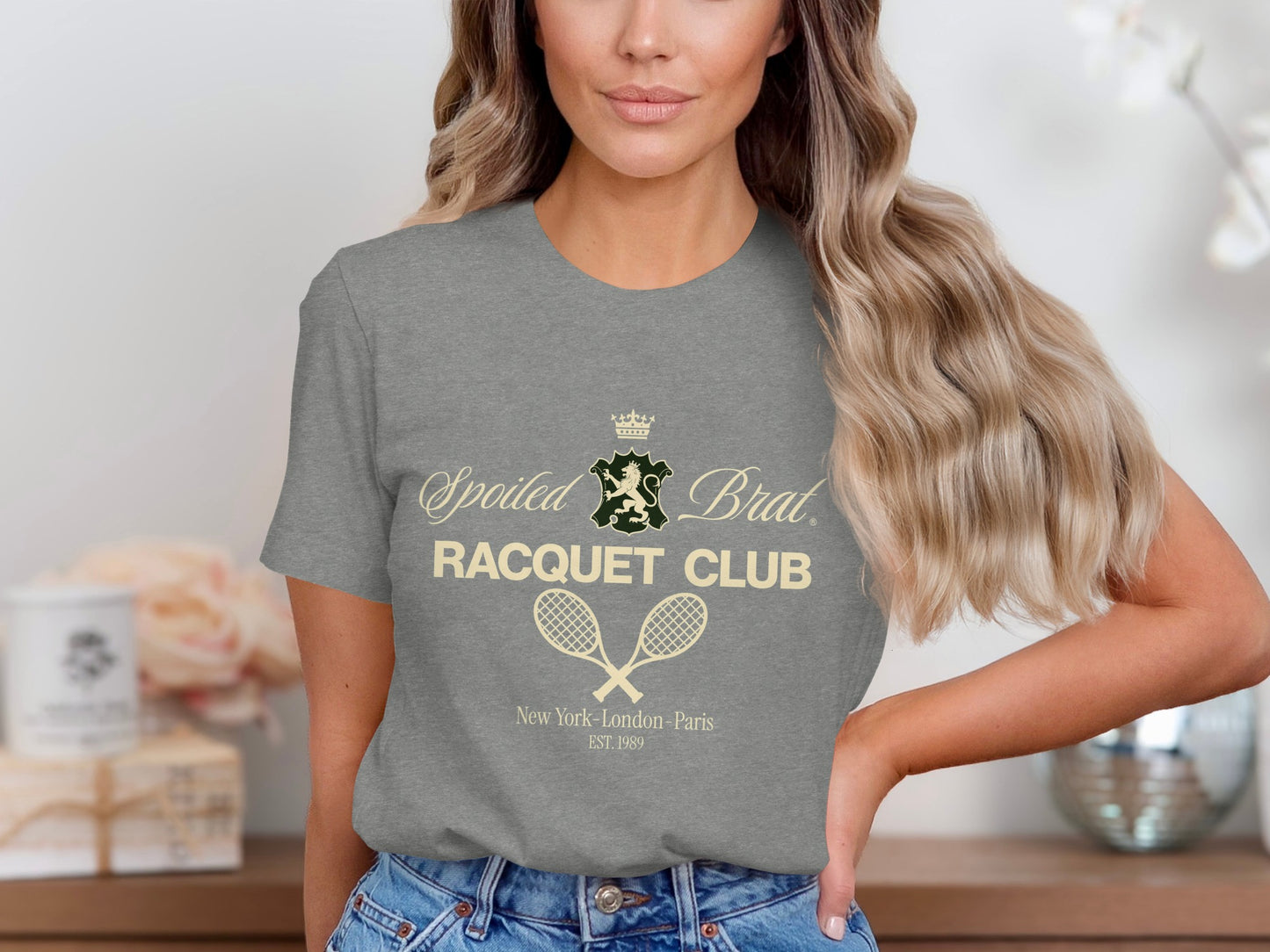 Grey t-shirt with Spoiled Brat Racquet Club logo and crossed tennis racquets.
