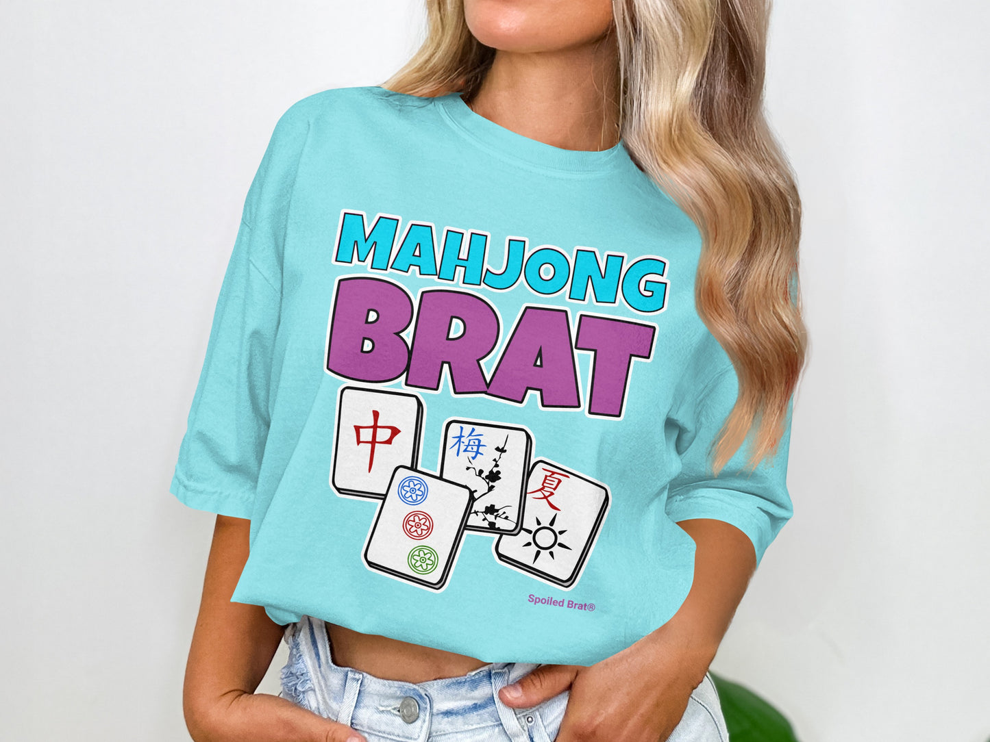 Aqua t-shirt with "Mahjong Brat" text and four mahjong tiles.