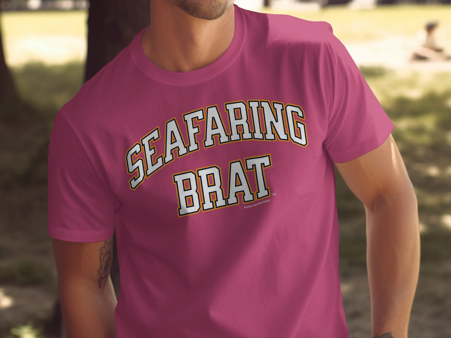 Magenta t-shirt with "SEA FARING BRAT" text in white and yellow outline.