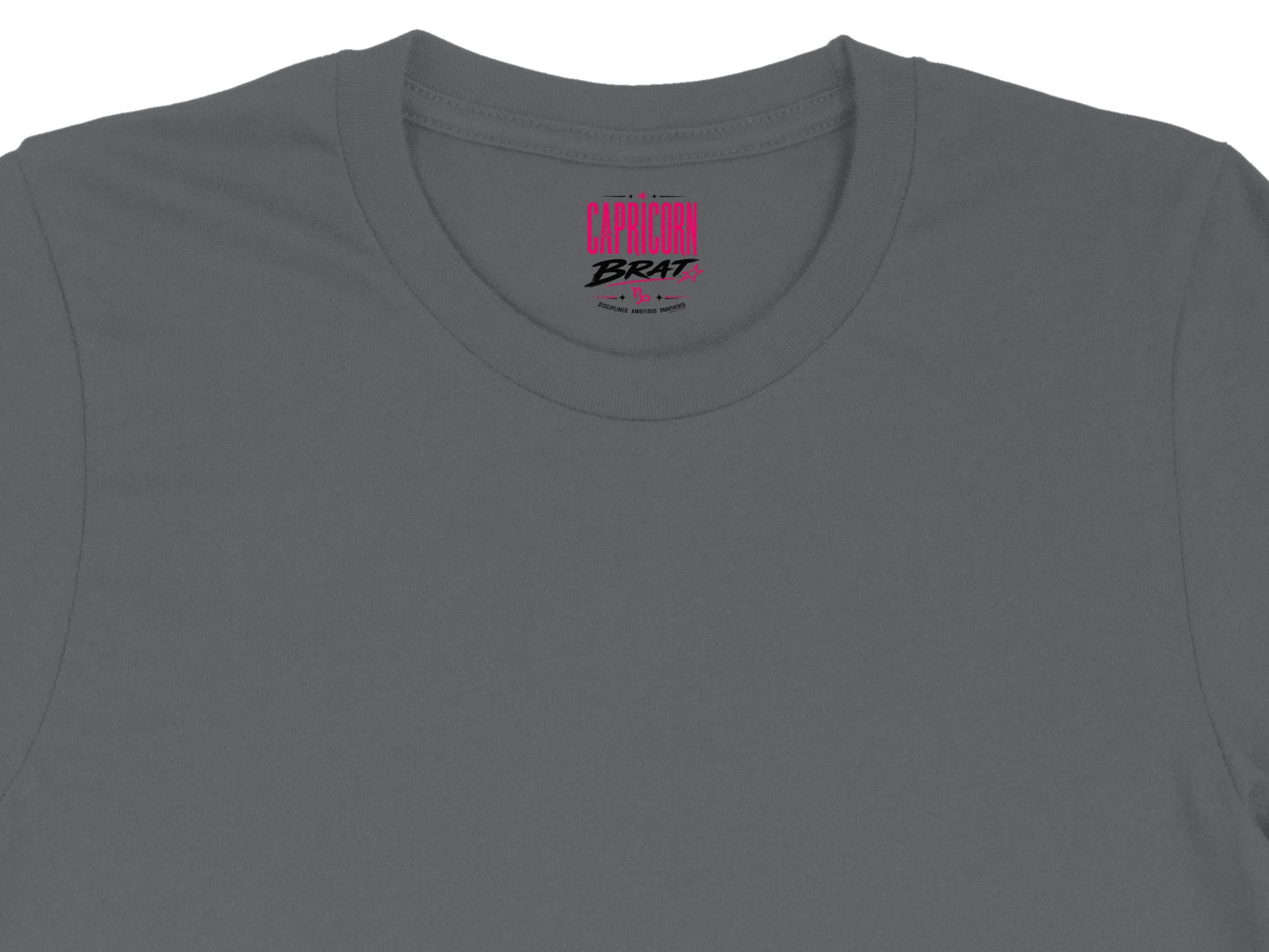 Capricorn Brat text with astrological symbols on a charcoal t-shirt collar.