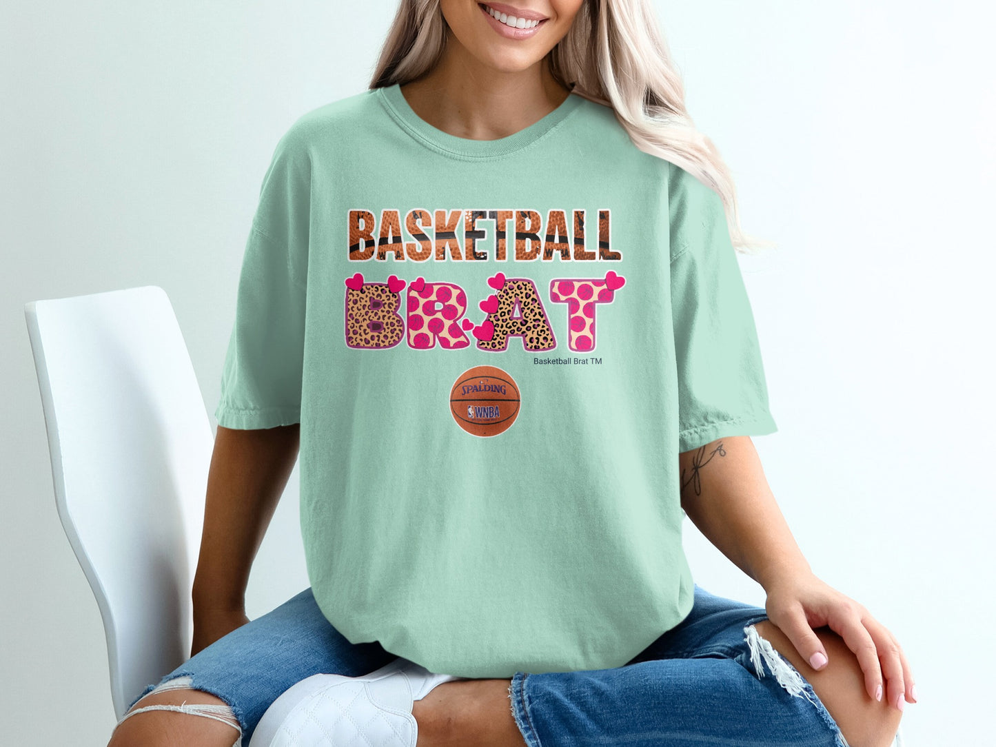 Light mint t-shirt with "BASKETBALL BRAT" in animal print lettering.