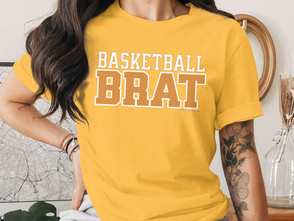 Yellow t-shirt with "BASKETBALL BRAT" text in white and orange.