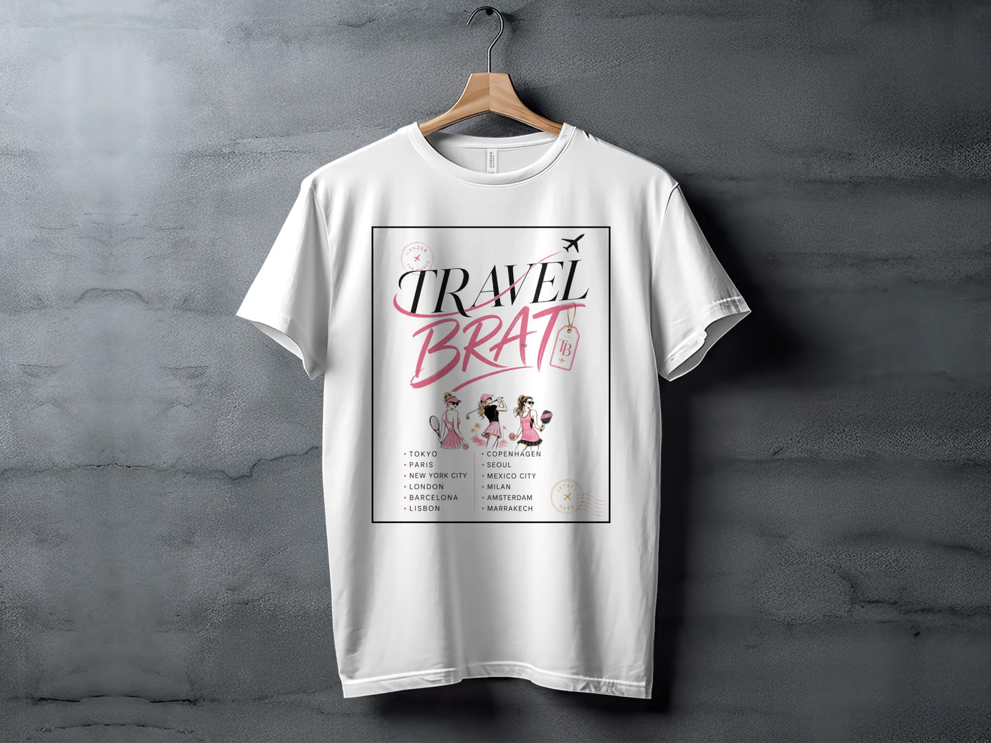 White t-shirt with "Travel Brat" text and list of cities featuring fashion illustrations.