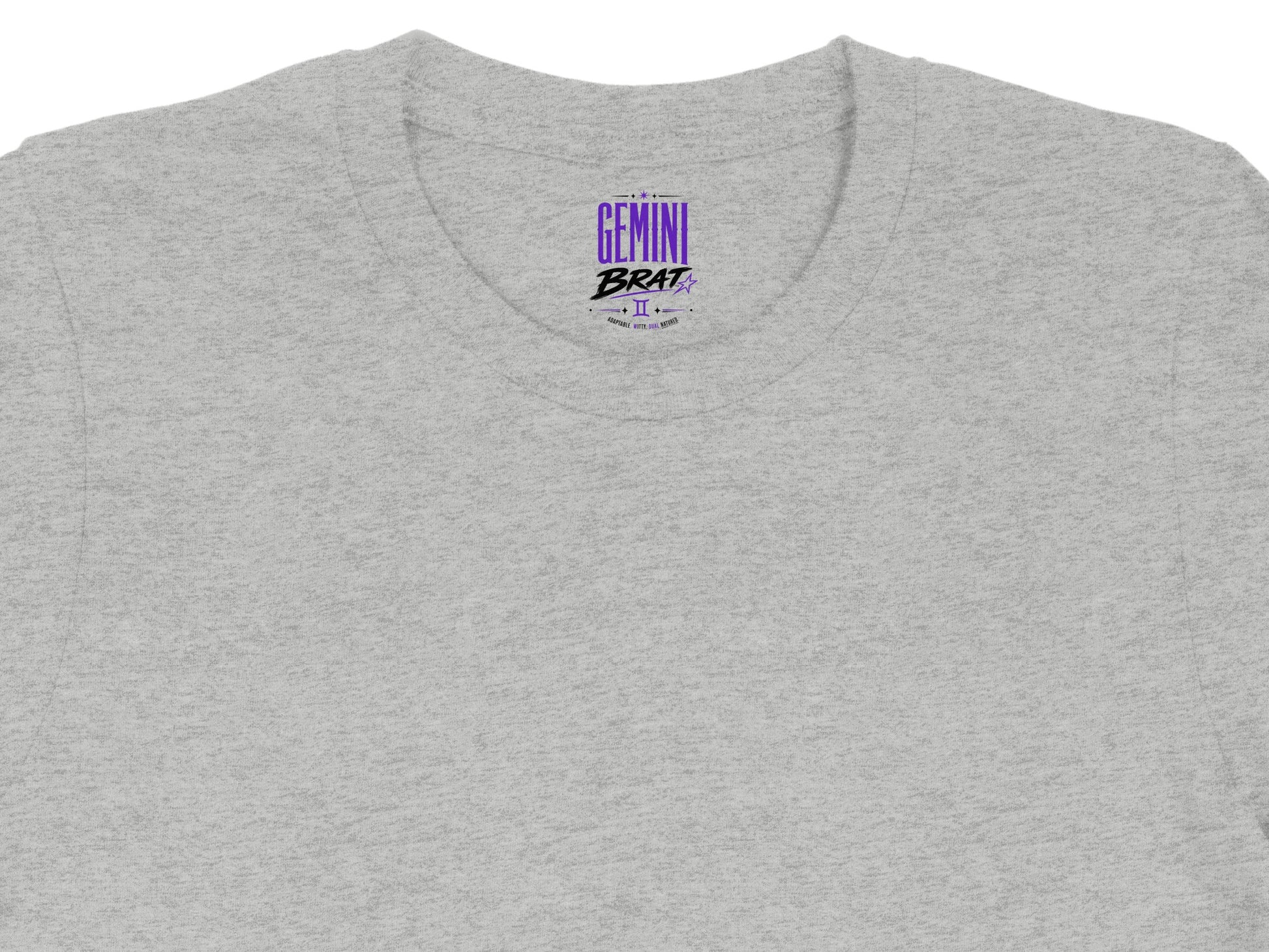 Grey t-shirt with purple "Gemini Brat" text and astrological symbol.
