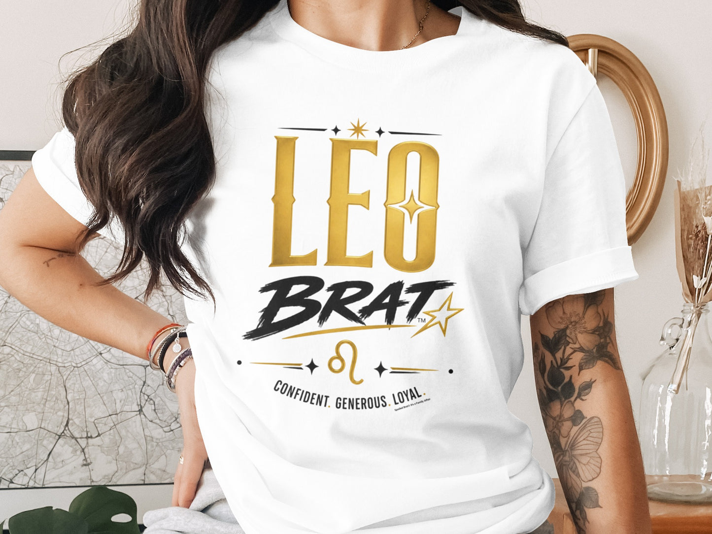 White t-shirt with "LEO BRAT" and Leo astrology symbol.