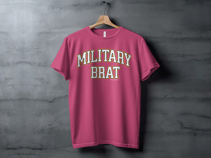 Pink t-shirt with "MILITARY BRAT" text in collegiate font.