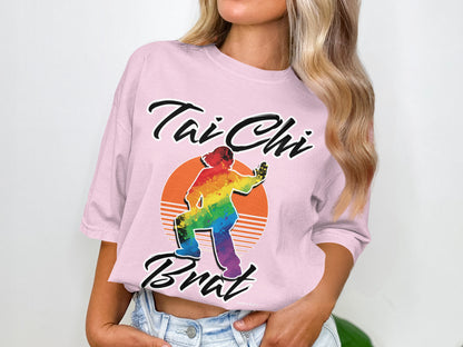Pink t-shirt with rainbow Tai Chi figure and "Tai Chi Brat" text.