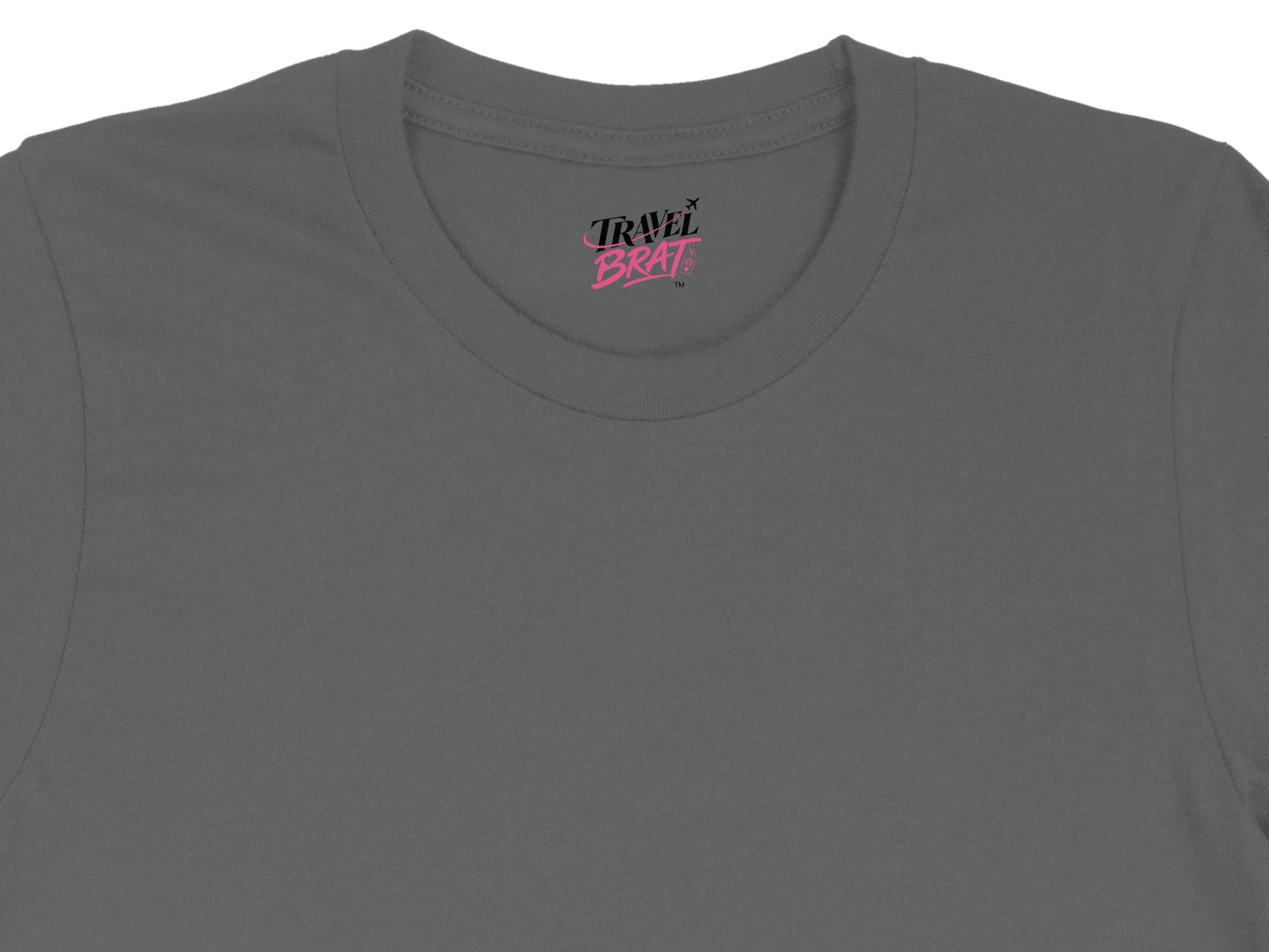 Gray t-shirt with pink "TRAVEL BRAT" logo on the collar.