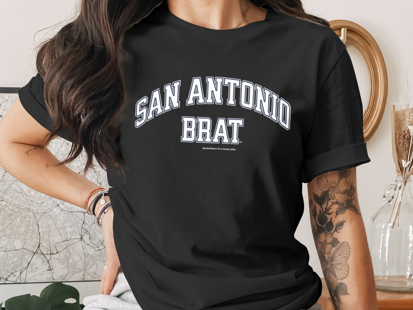 Black t-shirt with "San Antonio Brat" in white arched text.