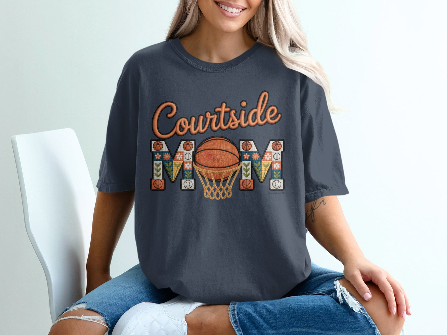 Dark t-shirt with "Courtside Mom" text and basketball net design.