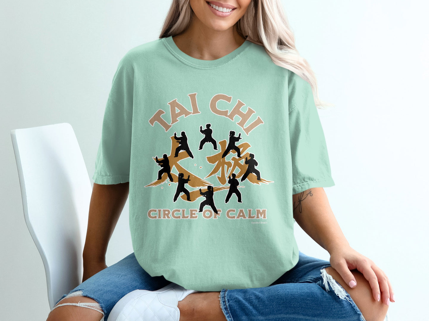 Mint green t-shirt with Tai Chi Circle of Calm graphic.