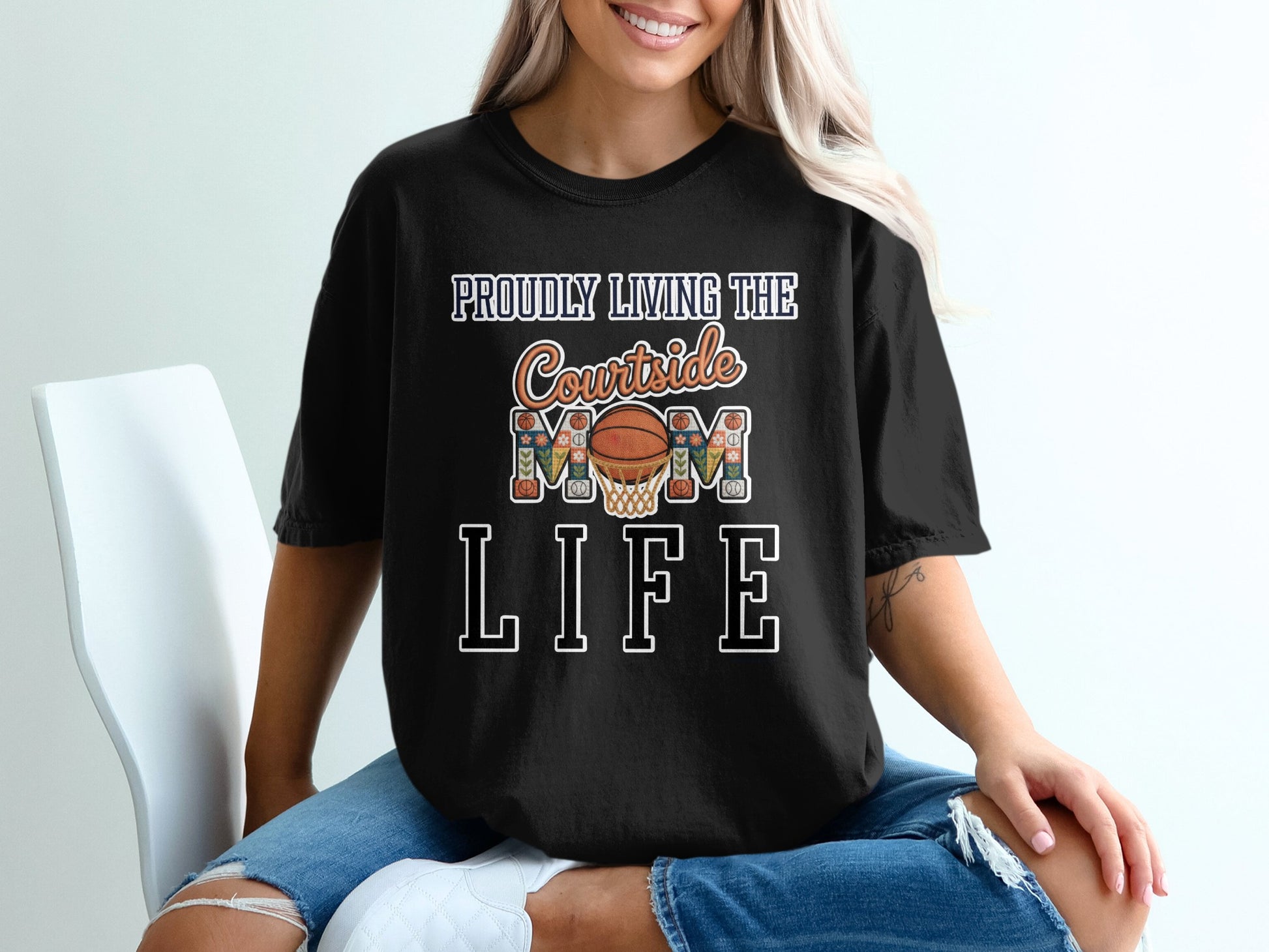 Black t-shirt with "Proudly Living the Courtside Mom Life" text and basketball graphics.