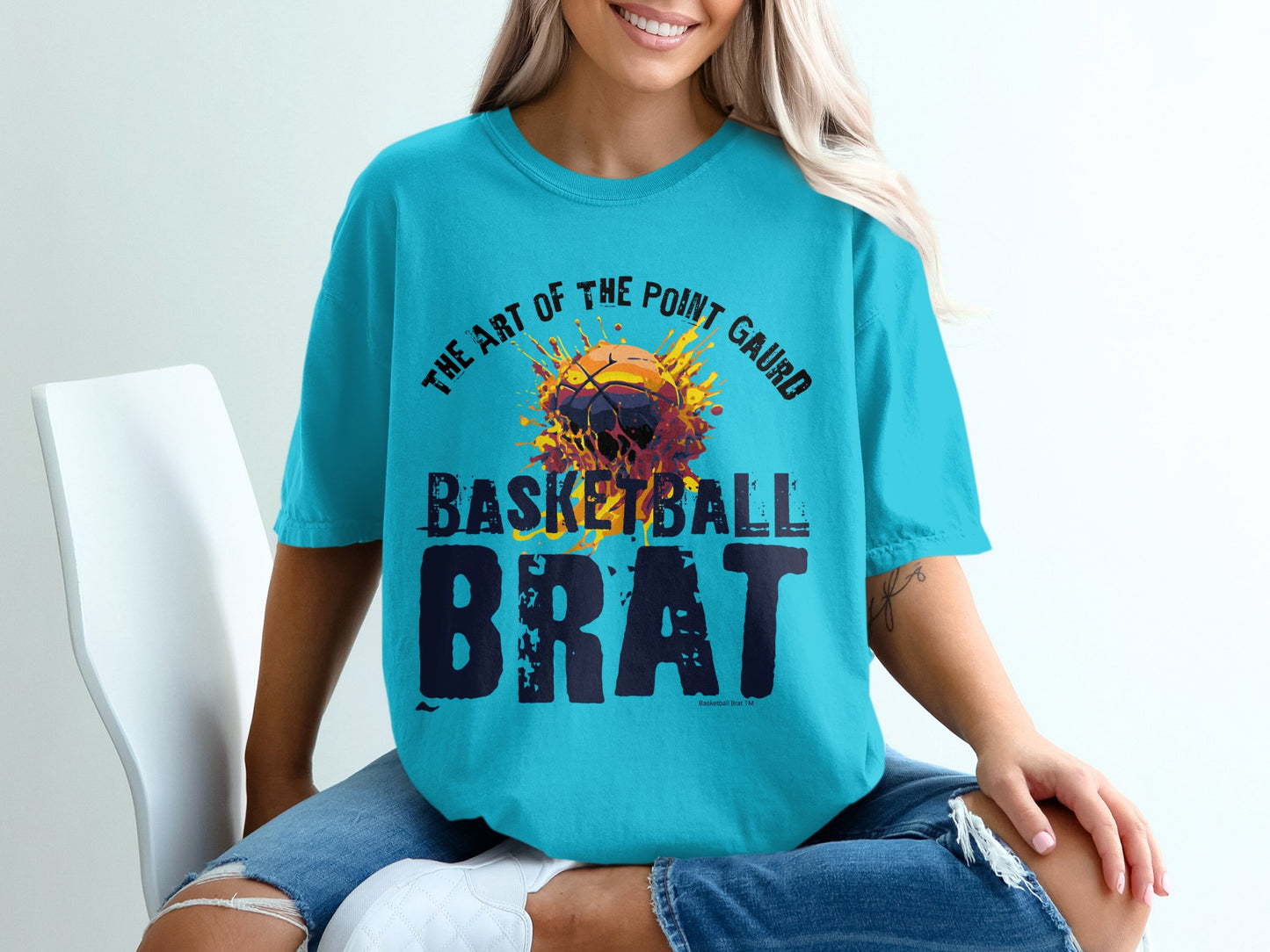 Turquoise t-shirt with "The Art of the Point Guard Brat" basketball graphic.