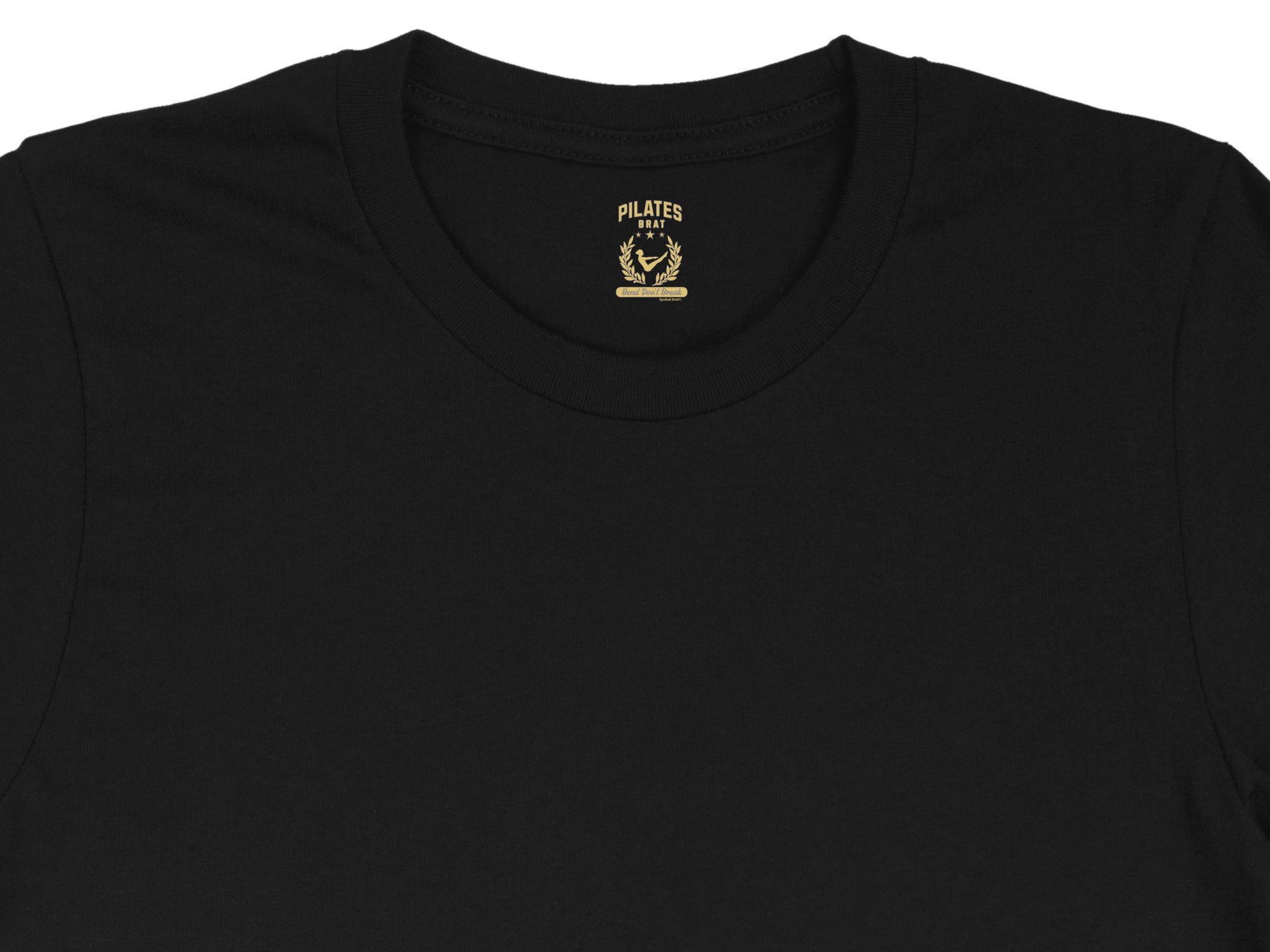 Black t-shirt with gold "PILATES BRAT" graphic, laurel wreath, and "Bent Don't Break" text.
