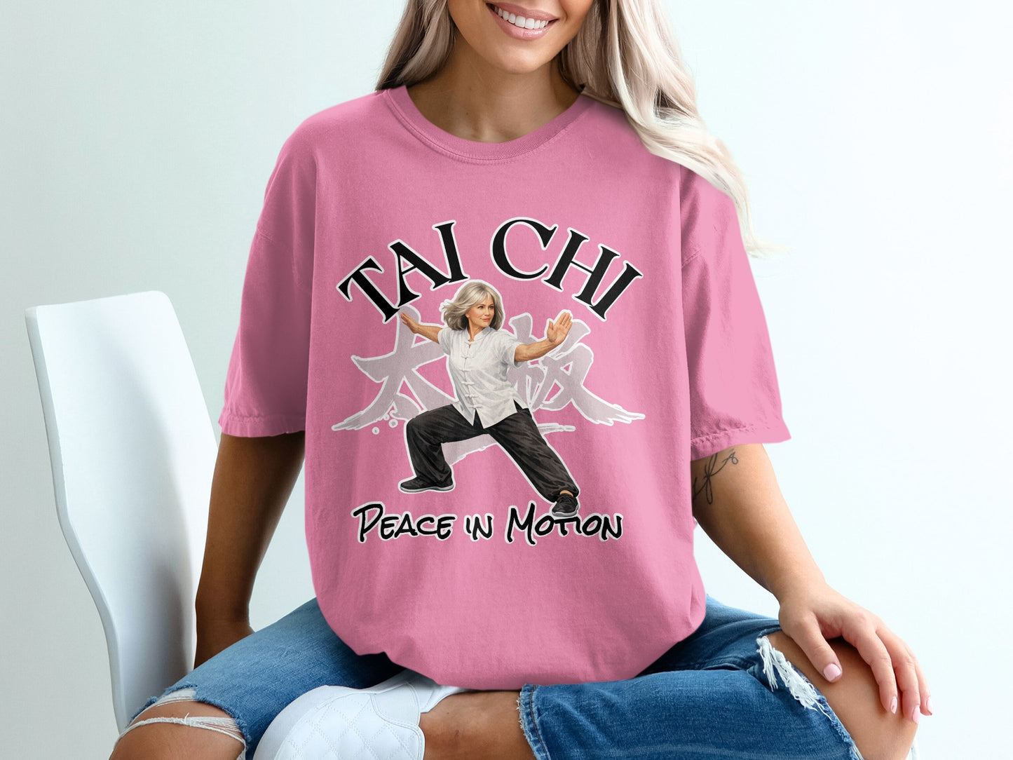 Pink t-shirt with "TAI CHI PEACE IN MOTION" text and woman in martial arts pose.