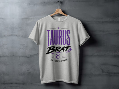 Light grey t-shirt with "TAURUS BRAT" and zodiac symbols.
