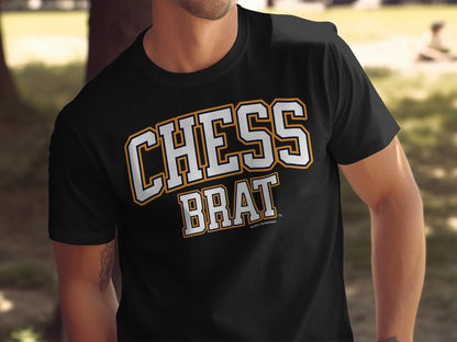 Black t-shirt with "CHESS BRAT" in white and gold sporty lettering.