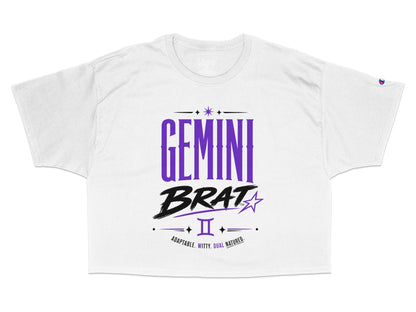 White crop t-shirt with "Gemini Brat" in purple and black, Gemini symbol, and text.