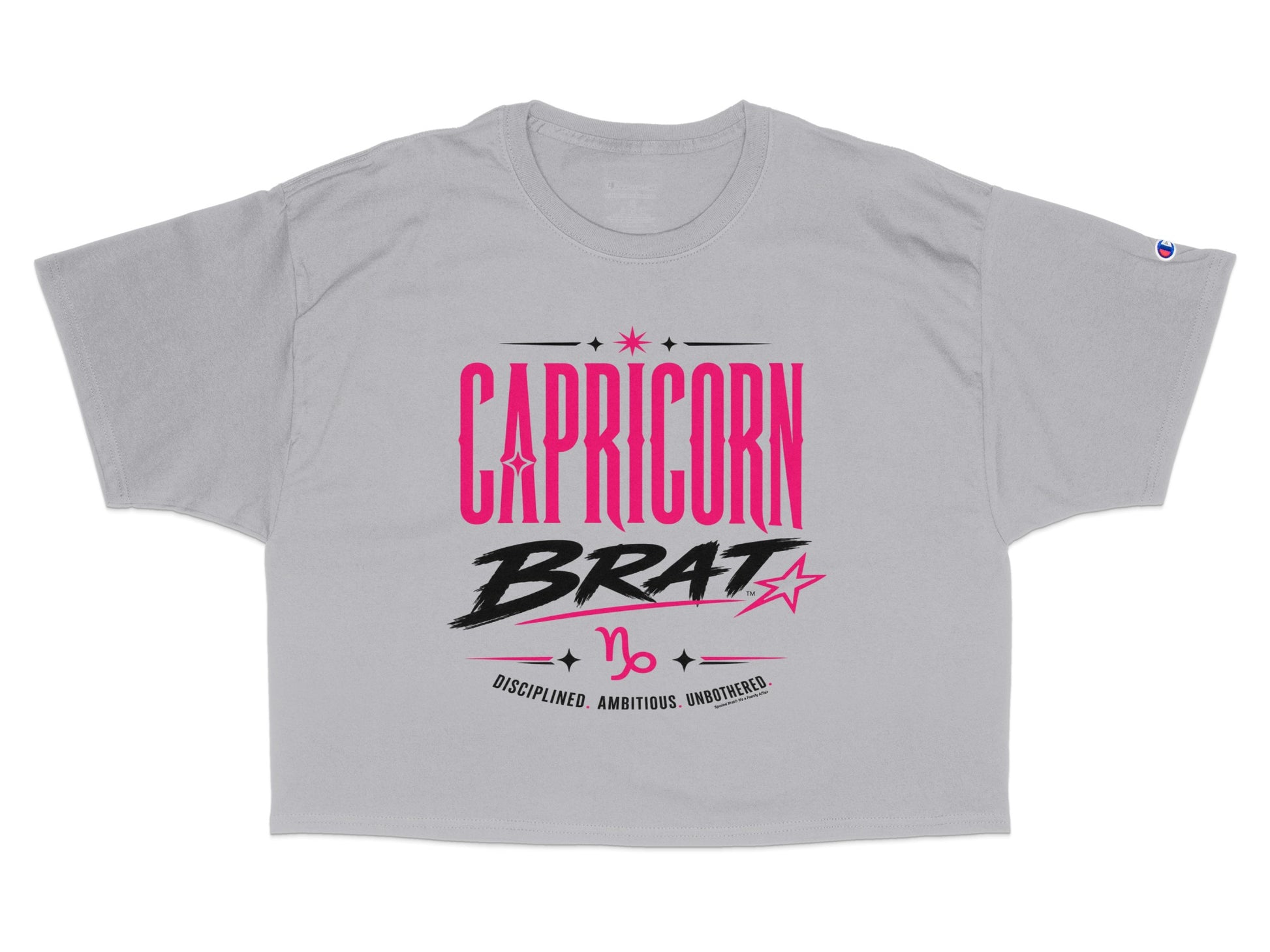 Grey t-shirt with "CAPRICORN BRAT" and zodiac symbol in pink and black.