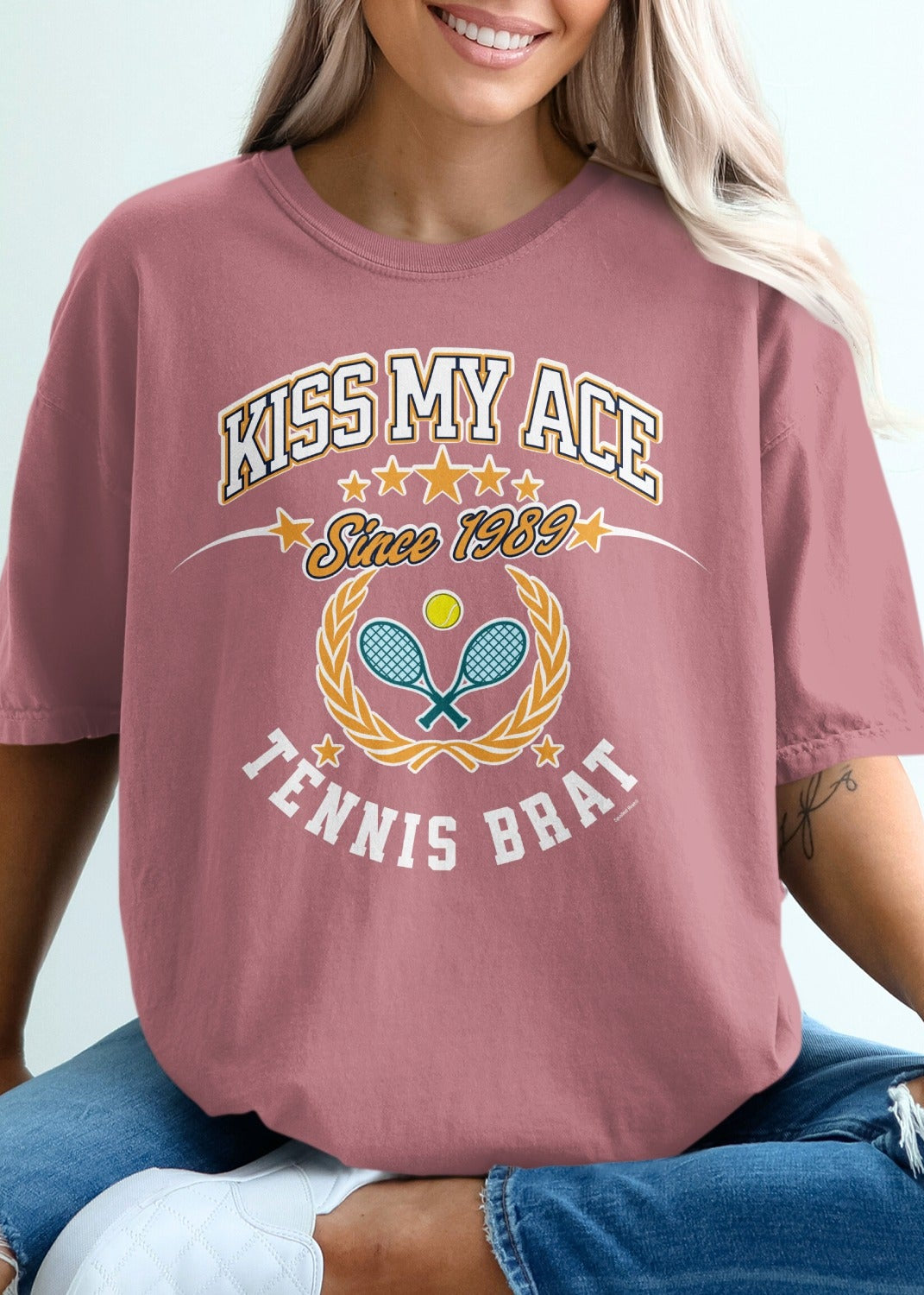 Tennis Brat t-shirt with "Kiss My Ace Since 1989" text and tennis imagery.