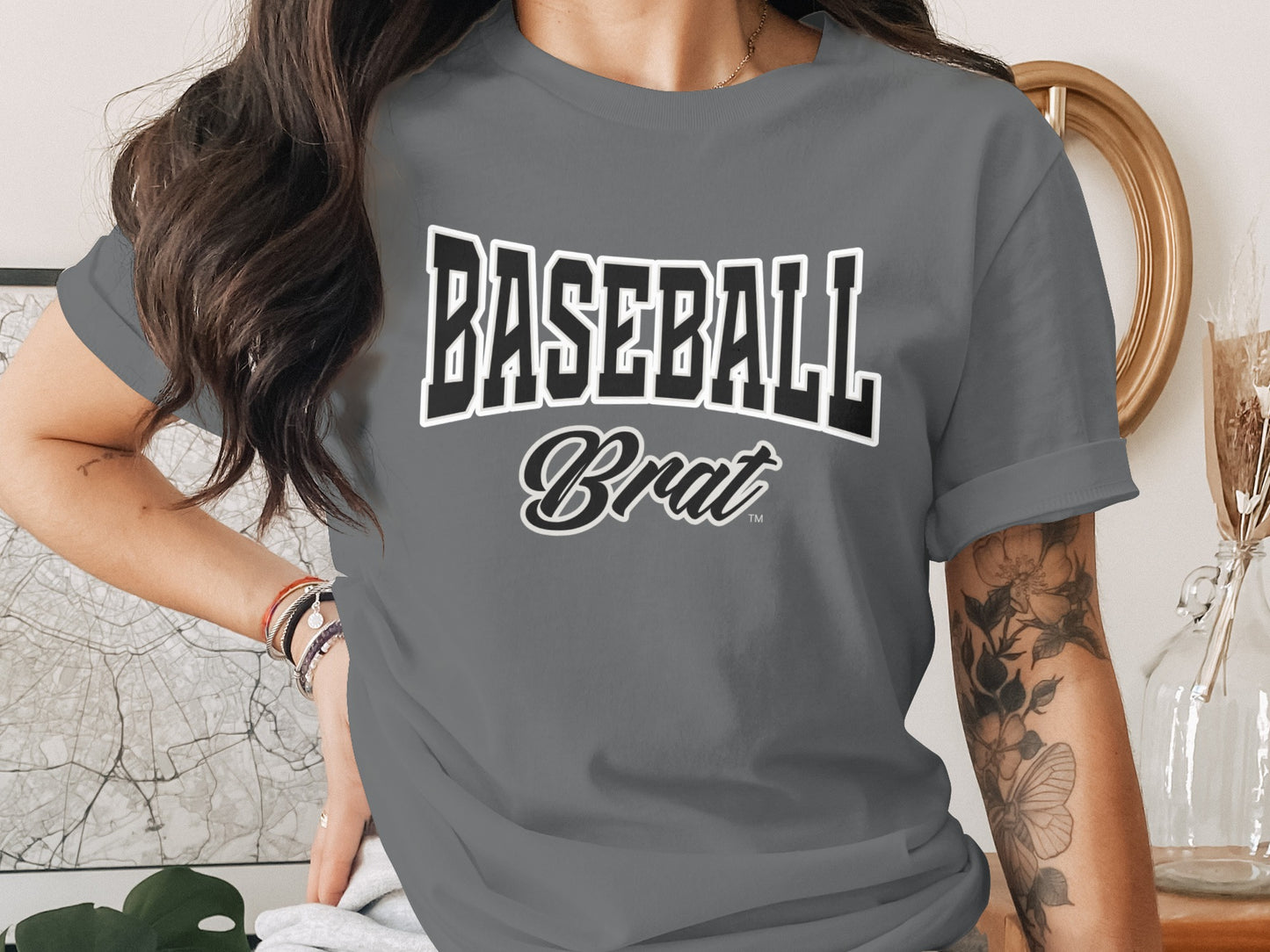 Gray t-shirt with "BASEBALL Brat" text in bold black and white lettering.