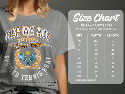Grey t-shirt with "Kiss My Ace Since 1989 Spoiled Tennis Brat" graphic and size chart.