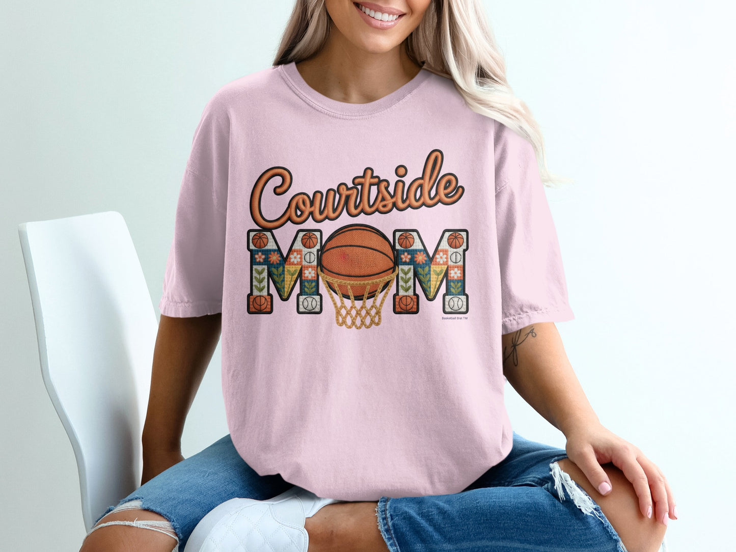 Pink t-shirt with "Courtside MOM" text and basketball hoop graphic.