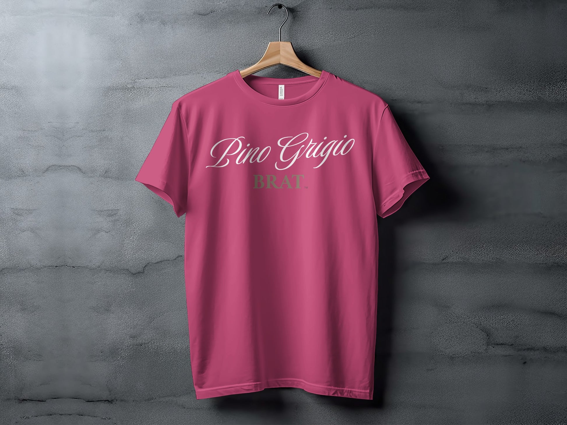 Fuchsia t-shirt with white script text "Pino Grigio" above olive green text "BRAT".