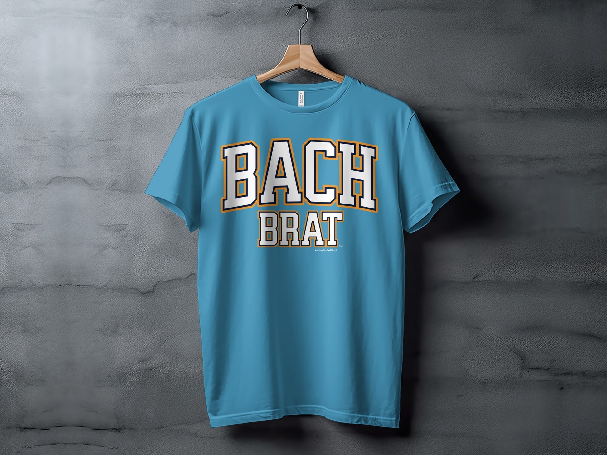 Blue t-shirt with "BACH BRAT" text in collegiate style lettering.