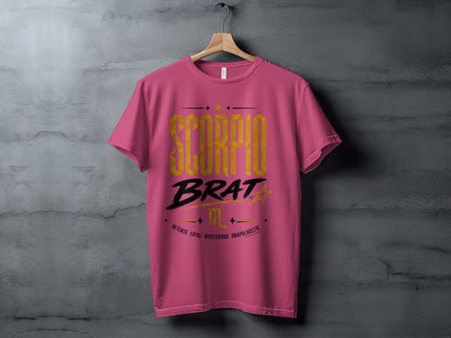 Pink t-shirt with gold "SCORPIO BRAT" text and descriptive words.