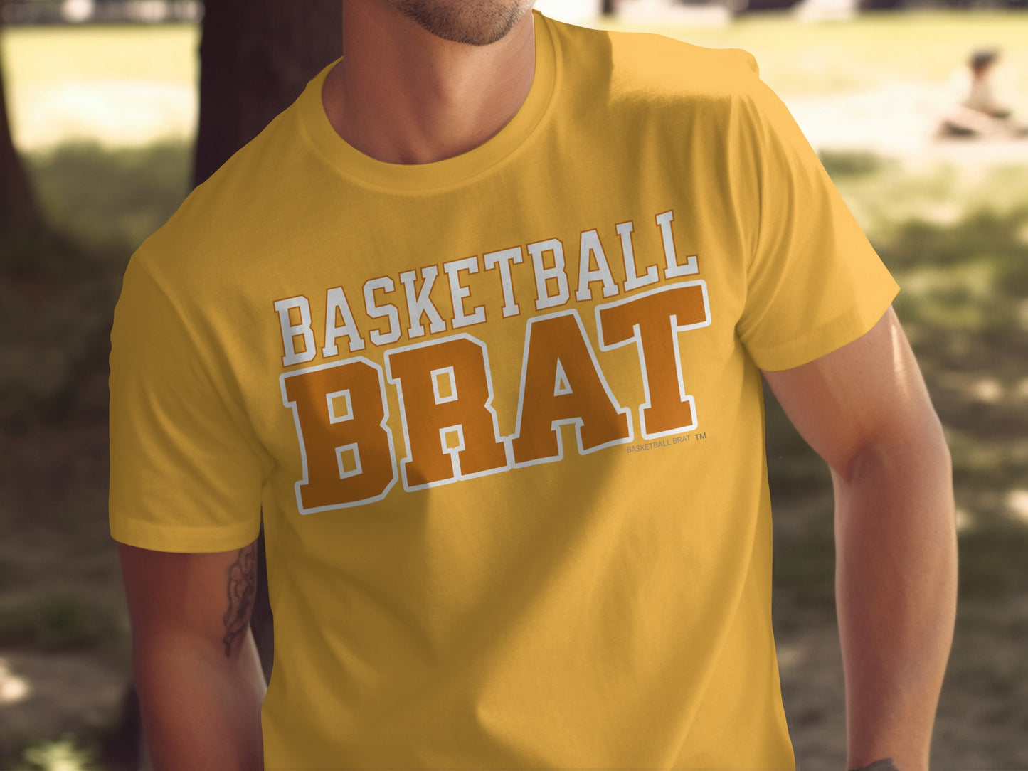 Orange t-shirt with white "BASKETBALL BRAT" text and basketball outline.