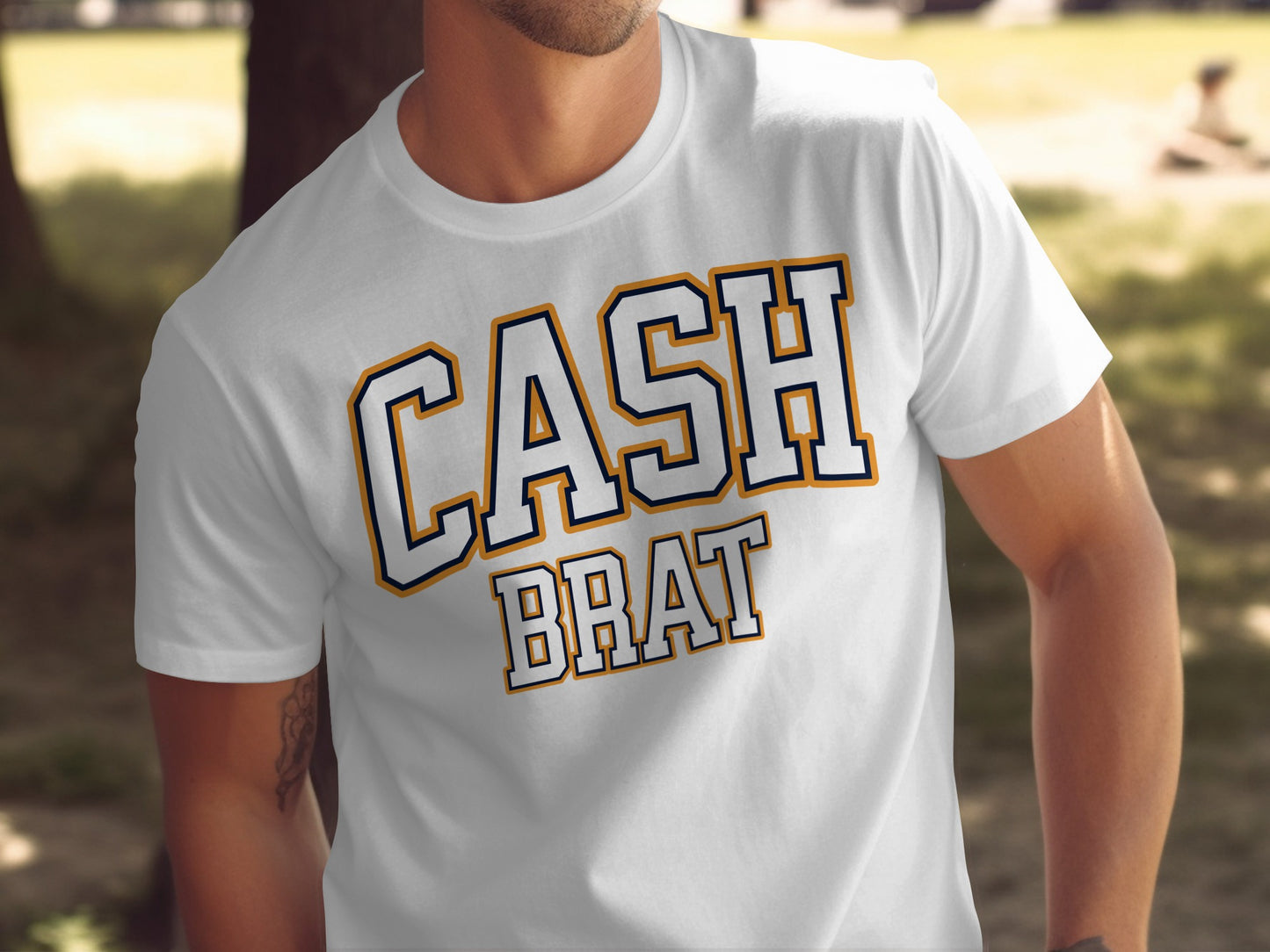 White t-shirt with "CASH BRAT" text in varsity-style lettering.