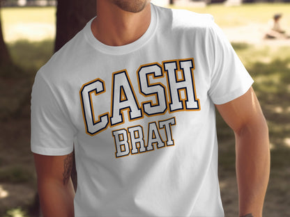 White t-shirt with "CASH BRAT" text in varsity-style lettering.