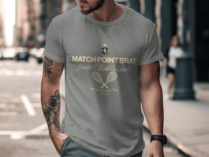 Grey t-shirt with "Match Point Brat" and tennis rackets graphic.