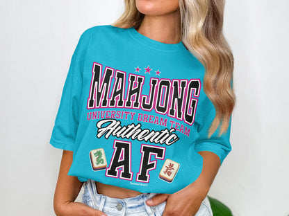 Turquoise t-shirt with "Mahjong University Dream Team Authentic AF" and Mahjong tiles.