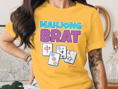 Yellow t-shirt with Mahjong Brat text and four Mahjong tiles.
