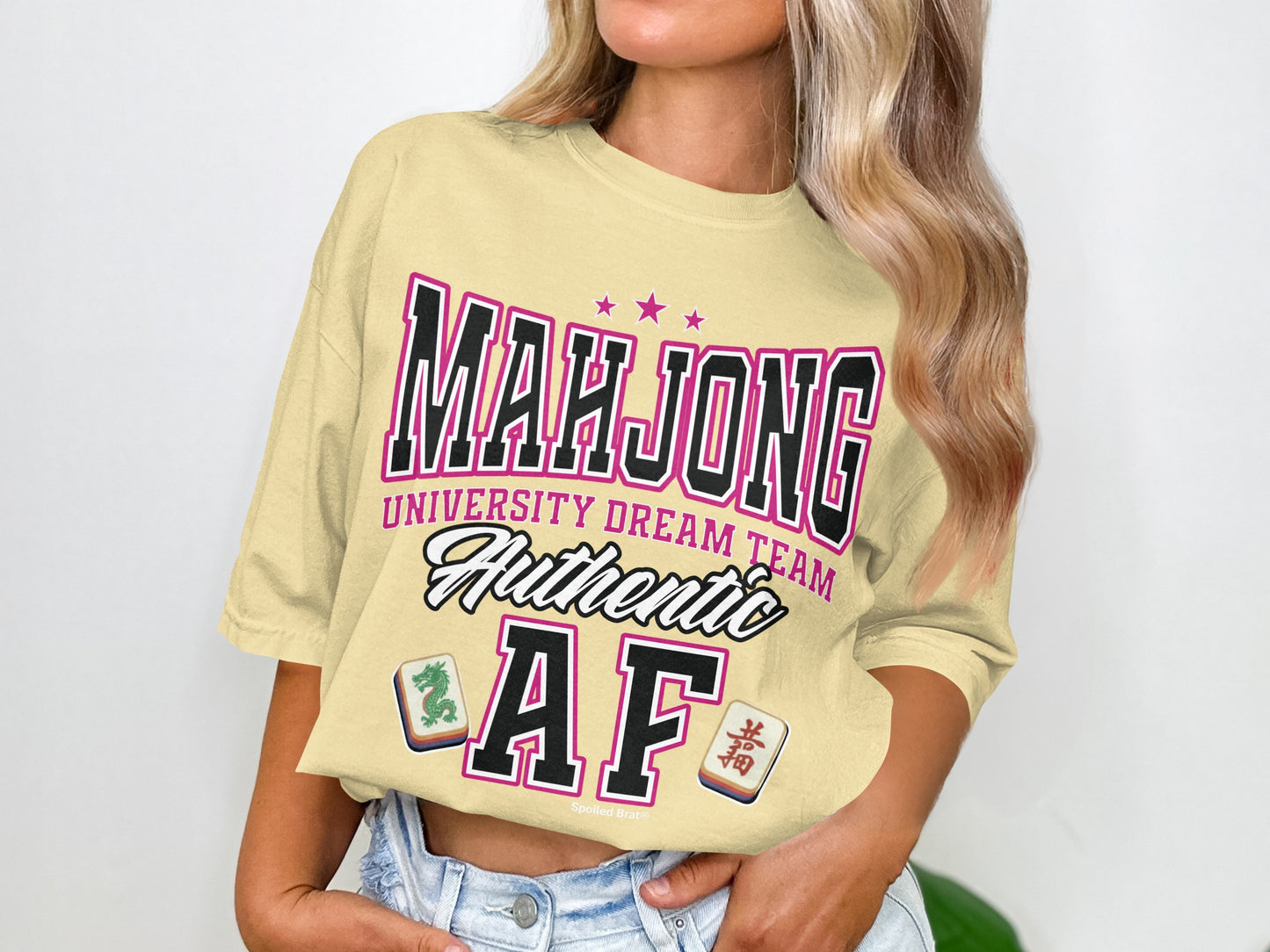 Cream t-shirt with "Mahjong University Dream Team Authentic AF" graphic.