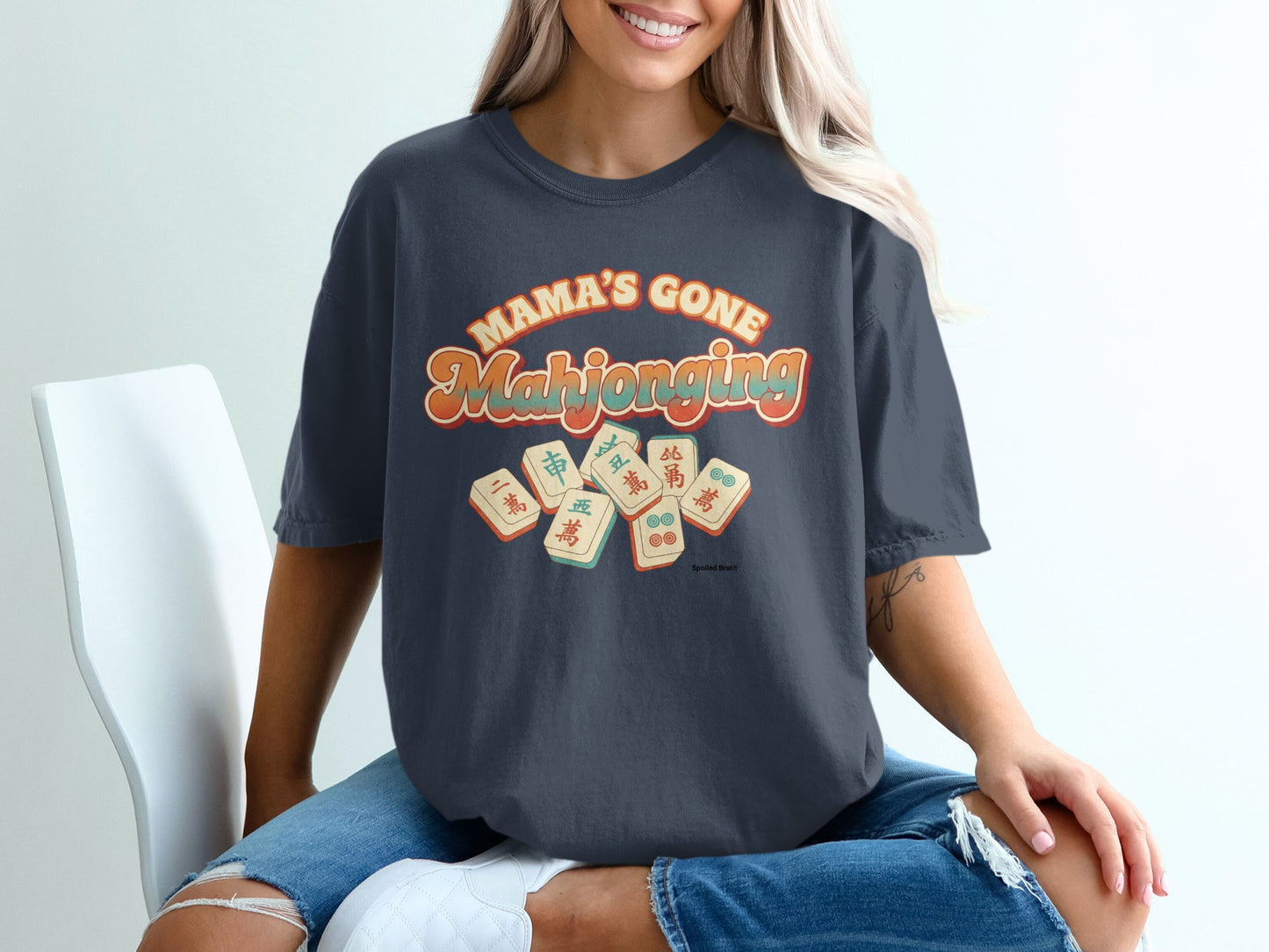 Dark t-shirt with "Mama's Gone Mahjong" text and mahjong tiles.