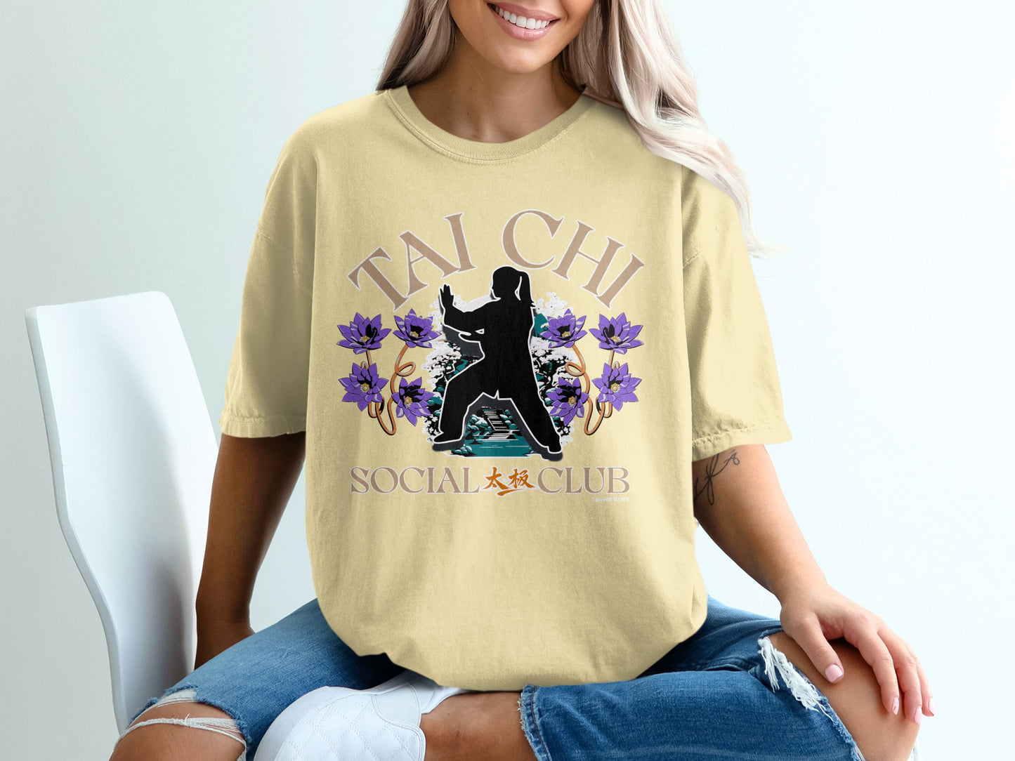 Yellow t-shirt with "Tai Chi Social Club" text and floral design.