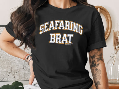 Black t-shirt with "SEAFARING BRAT" in white and yellow collegiate lettering.