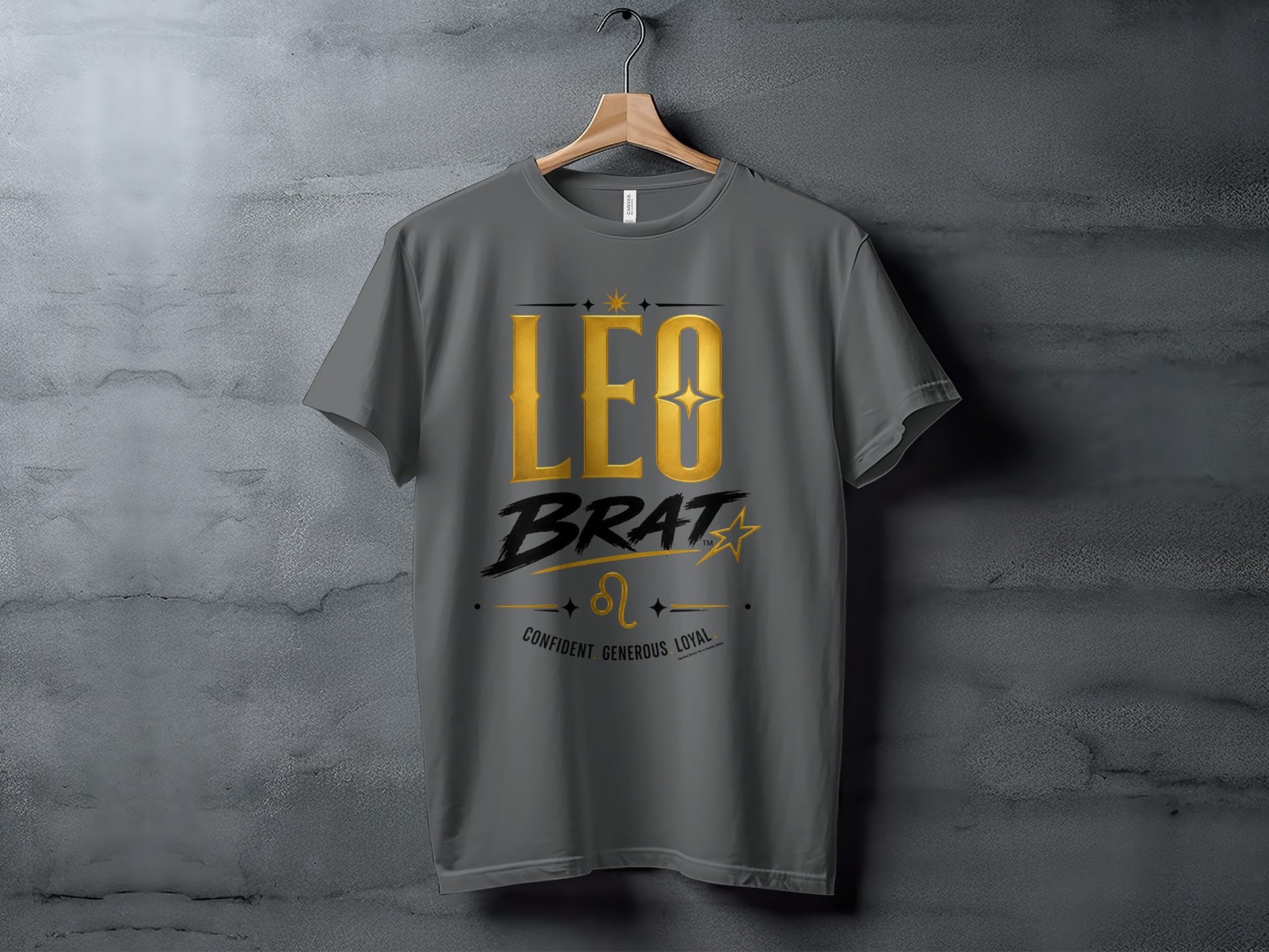 Gray t-shirt with gold text "LEO BRAT", Leo symbol, and words "CONFIDENT GENEROUS LOYAL".